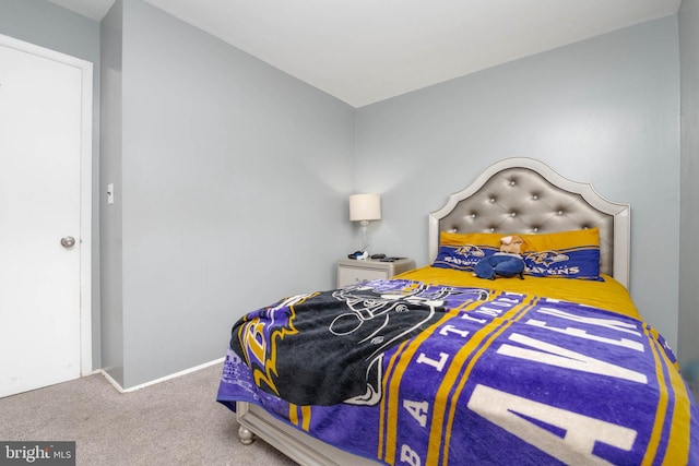 carpeted bedroom with baseboards