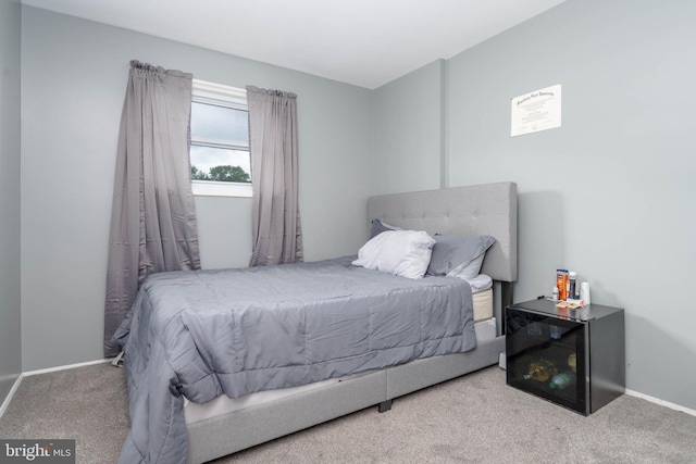 bedroom with carpet and baseboards