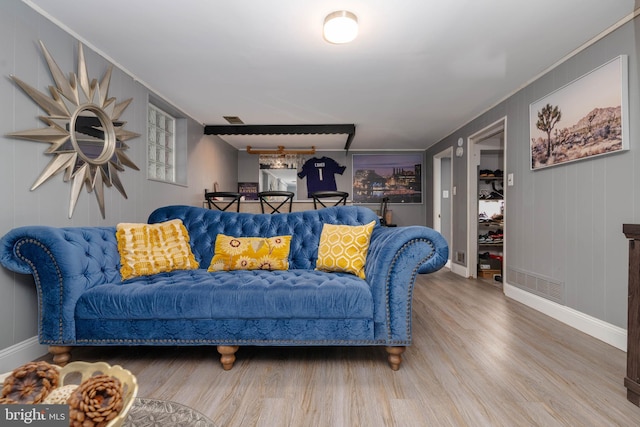 living room with wood finished floors and baseboards