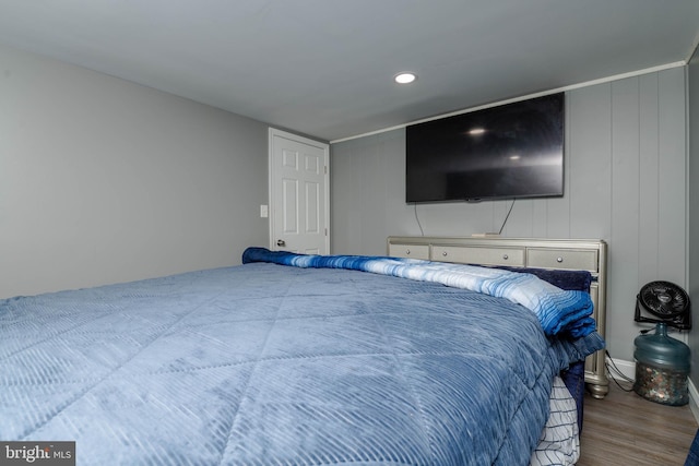 bedroom featuring wood finished floors and recessed lighting