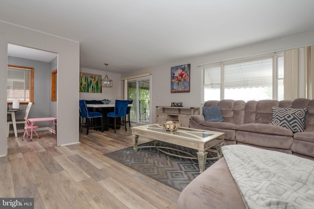 living area with wood finished floors and baseboards
