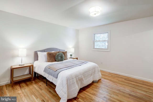 809 N Arch St, Mechanicsburg, PA 17055 - bedroom with light wood-type flooring and baseboards
