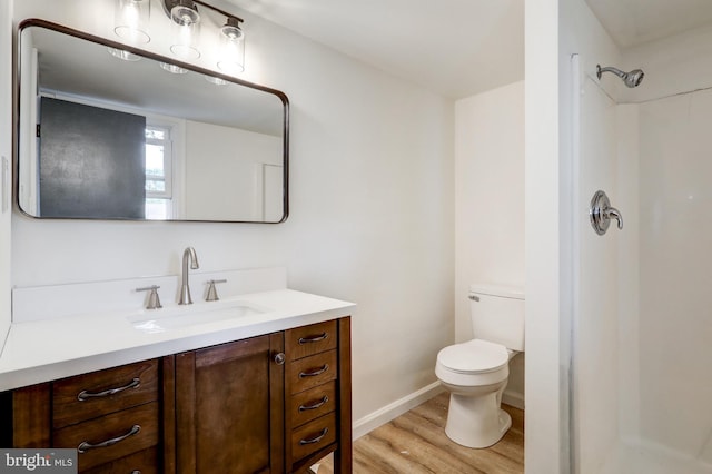 809 N Arch St, Mechanicsburg, PA 17055 - full bathroom featuring wood finished floors, vanity, toilet, and a shower