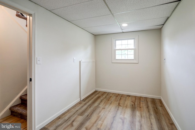 809 N Arch St, Mechanicsburg, PA 17055 - unfurnished room with a drop ceiling, light wood finished floors, stairway, and baseboards