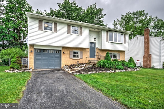 809 N Arch St, Mechanicsburg, PA 17055 - raised ranch with brick siding, a front lawn, and driveway
