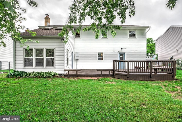 809 N Arch St, Mechanicsburg, PA 17055 - rear view of property featuring a wooden deck, a yard, and a chimney