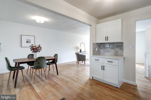 809 N Arch St, Mechanicsburg, PA 17055 - dining area featuring light wood-type flooring and baseboards
