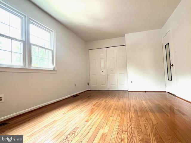 5044 Head Ct, Fairfax, VA 22032 - unfurnished bedroom with light wood finished floors, baseboards, and a closet