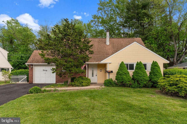 20 Hollow Rd, Levittown, PA 19056 - view of front of property featuring asphalt driveway, a shingled roof, and brick siding