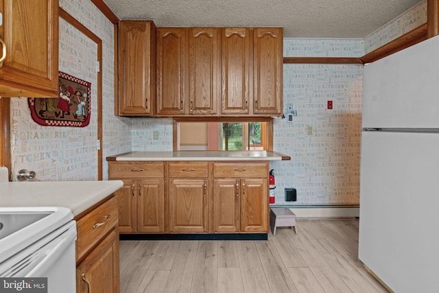20 Hollow Rd, Levittown, PA 19056 - kitchen featuring white appliances, wallpapered walls, light countertops, baseboards, and light wood finished floors