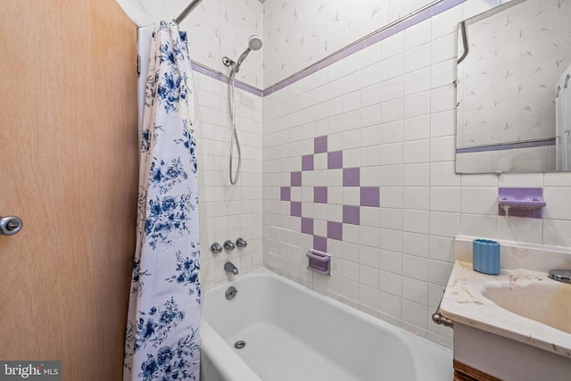bathroom with shower / tub combo and vanity