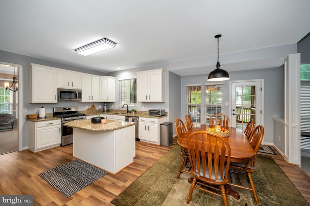 32 Beau Ridge Dr, Stafford, VA 22556 - kitchen featuring stainless steel appliances, white cabinets, light wood-style floors, and plenty of natural light