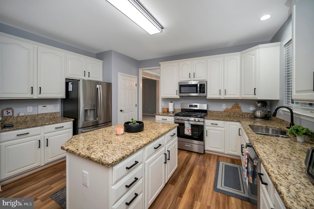 32 Beau Ridge Dr, Stafford, VA 22556 - kitchen with appliances with stainless steel finishes, a sink, dark wood-type flooring, a center island, and recessed lighting
