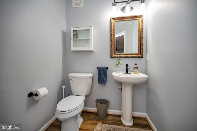 32 Beau Ridge Dr, Stafford, VA 22556 - bathroom with toilet, wood finished floors, baseboards, and a sink