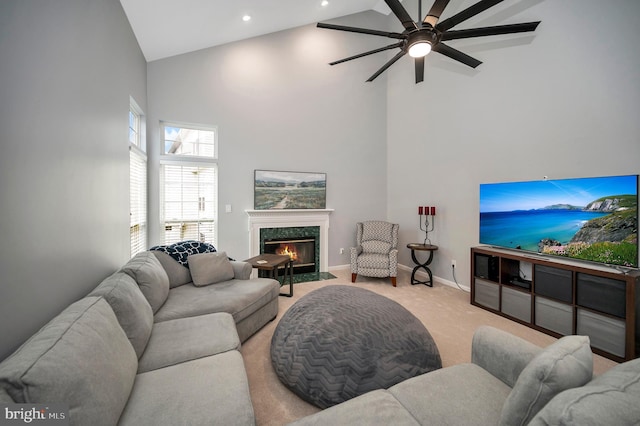 32 Beau Ridge Dr, Stafford, VA 22556 - living room featuring high vaulted ceiling, light carpet, a ceiling fan, a premium fireplace, and baseboards