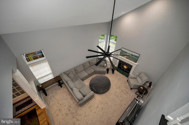 32 Beau Ridge Dr, Stafford, VA 22556 - carpeted living room featuring high vaulted ceiling, a fireplace, and a ceiling fan