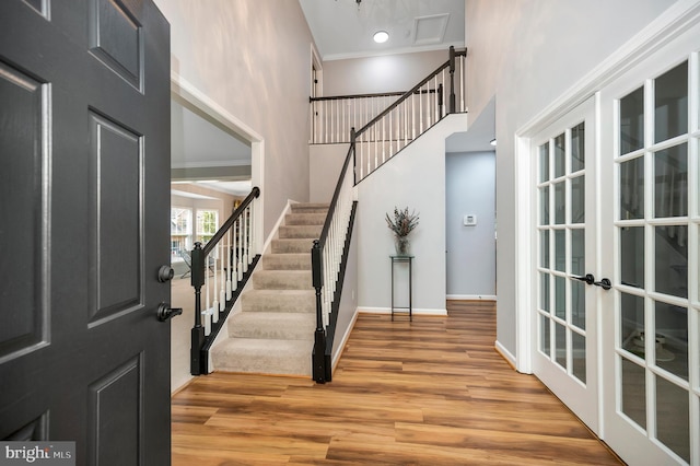 32 Beau Ridge Dr, Stafford, VA 22556 - entryway with a towering ceiling, wood finished floors, french doors, stairs, and baseboards