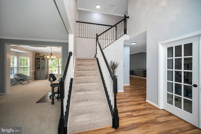 32 Beau Ridge Dr, Stafford, VA 22556 - staircase with a chandelier, ornamental molding, baseboards, a high ceiling, and wood finished floors