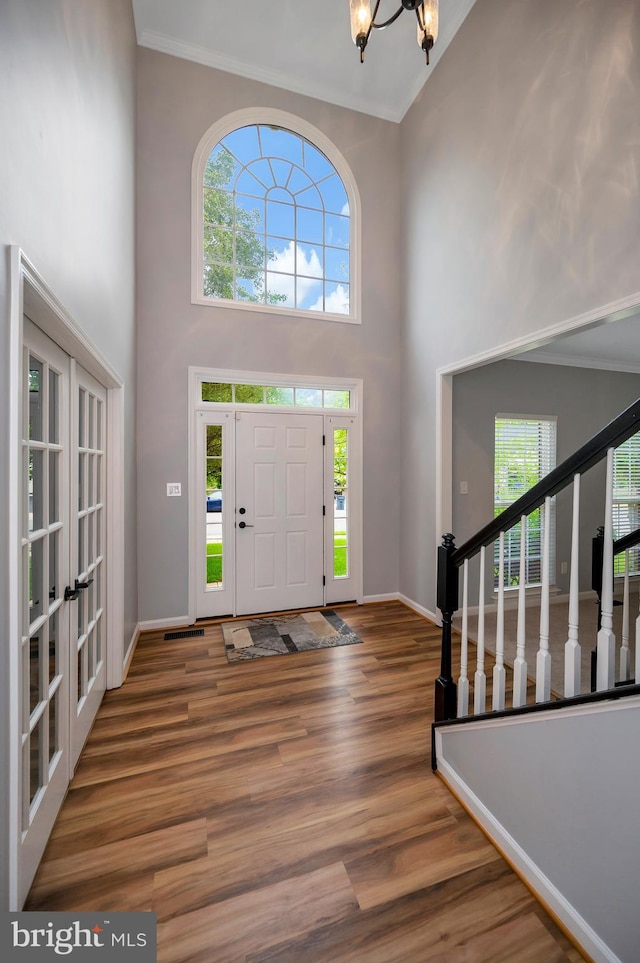 32 Beau Ridge Dr, Stafford, VA 22556 - entrance foyer featuring a towering ceiling, wood finished floors, baseboards, ornamental molding, and a chandelier