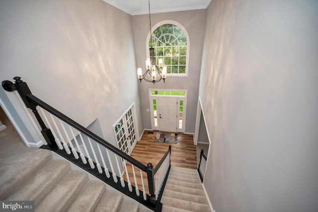 32 Beau Ridge Dr, Stafford, VA 22556 - foyer with a chandelier, baseboards, wood finished floors, ornamental molding, and stairway