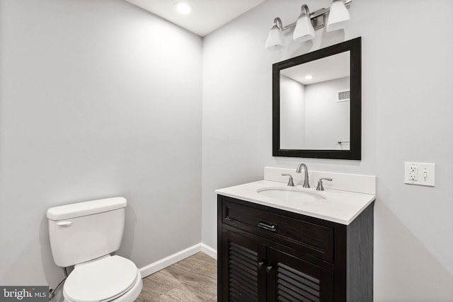 32 Beau Ridge Dr, Stafford, VA 22556 - bathroom featuring baseboards, wood finished floors, toilet, vanity, and recessed lighting
