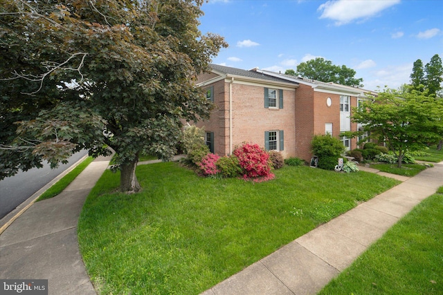 4559 Airlie Way, Annandale, VA 22003 - view of home's exterior featuring brick siding and a yard
