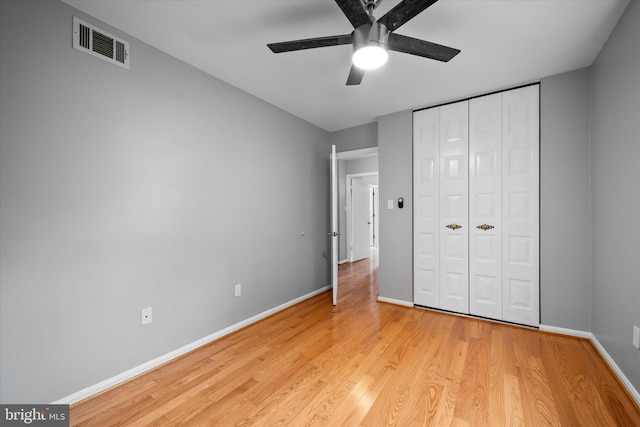 4559 Airlie Way, Annandale, VA 22003 - unfurnished bedroom with light wood-style flooring, baseboards, a closet, and a ceiling fan