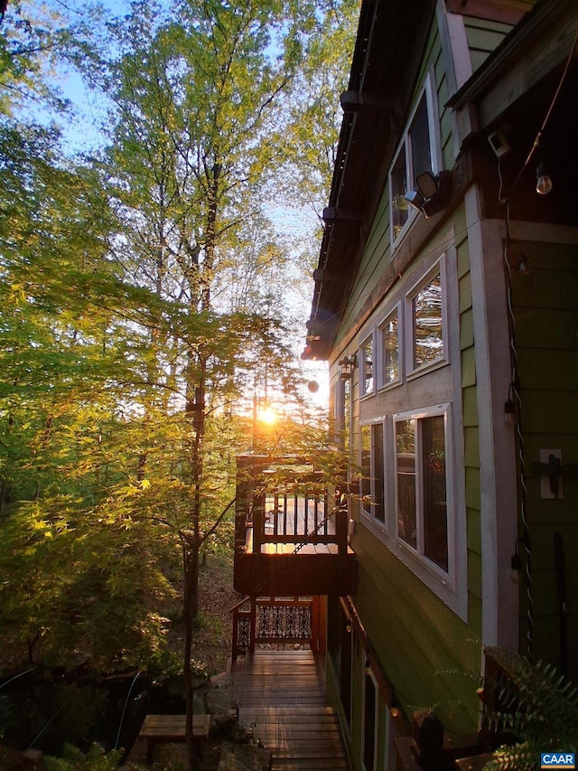view of home's exterior with a deck and stairway