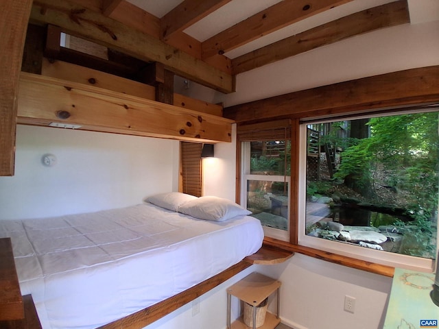 bedroom featuring beam ceiling