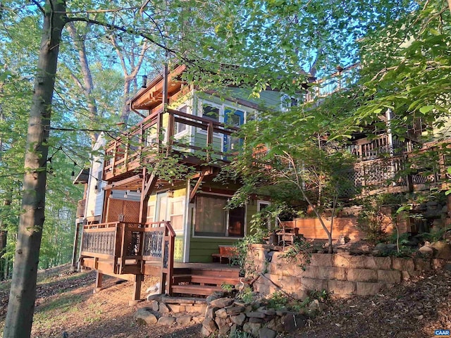 back of house with a wooden deck