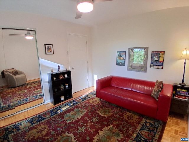 living room with a ceiling fan