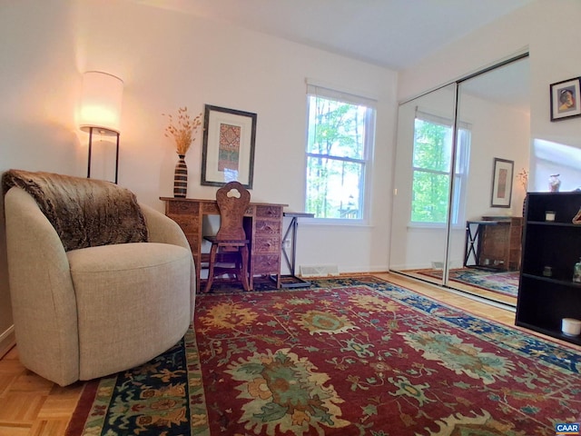 living area featuring baseboards