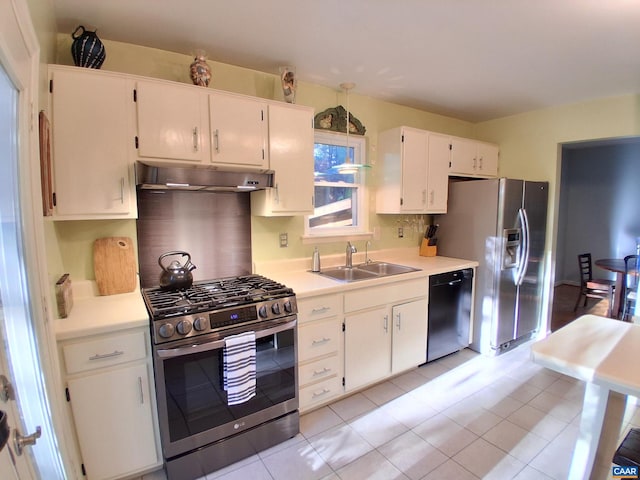 kitchen featuring stainless steel appliances, a sink, under cabinet range hood, light countertops, and white cabinets
