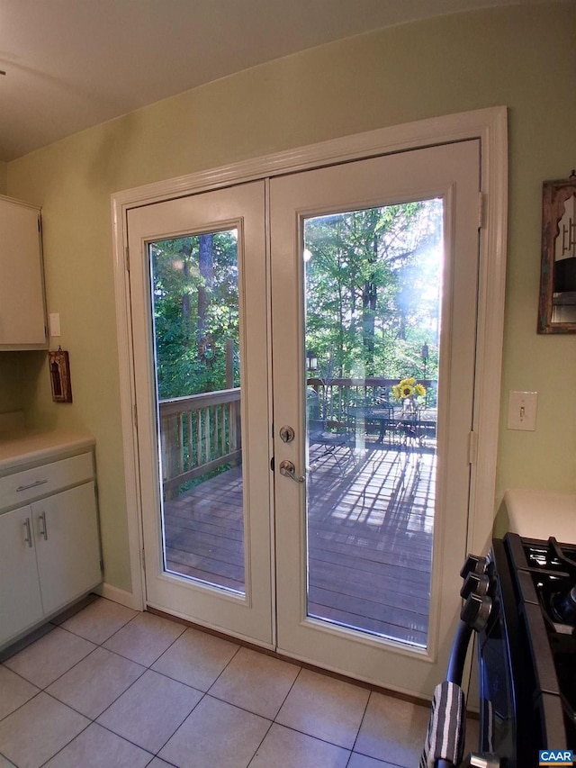 entryway with french doors and light tile patterned floors