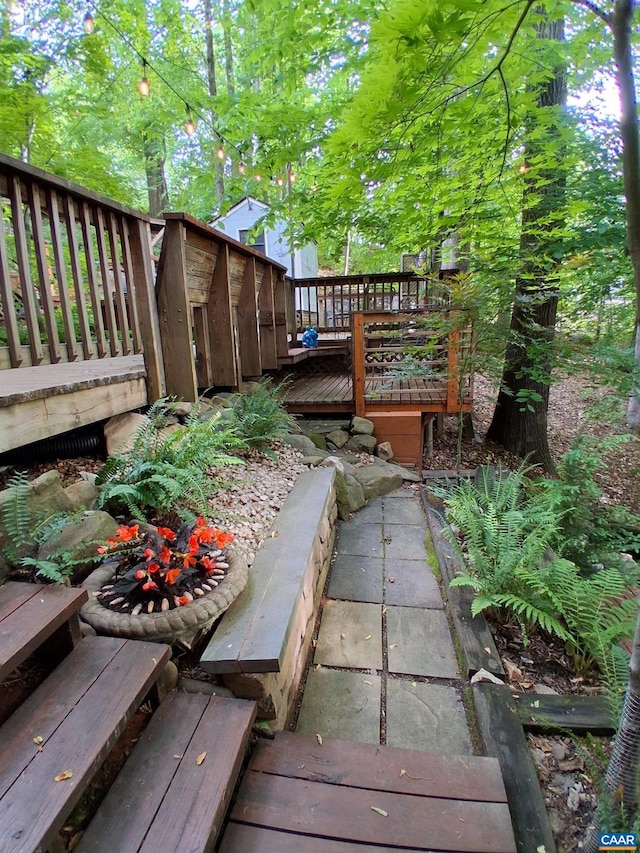 view of yard featuring a wooden deck