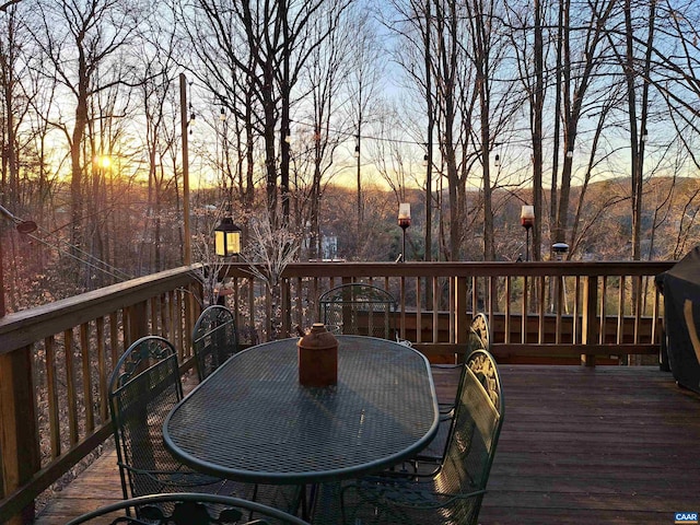 wooden deck with outdoor dining area
