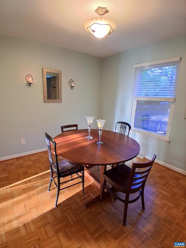 dining room featuring baseboards