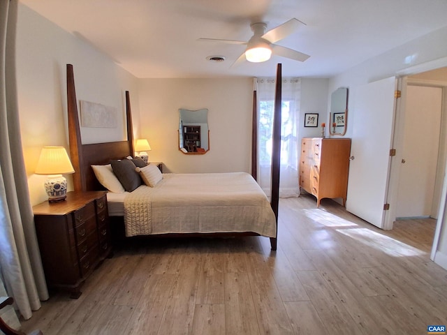 bedroom with light wood-type flooring and a ceiling fan
