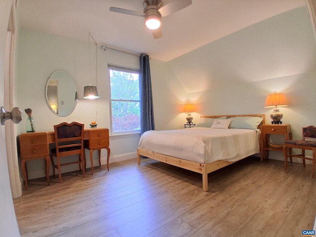 bedroom featuring hardwood / wood-style floors, baseboards, and ceiling fan