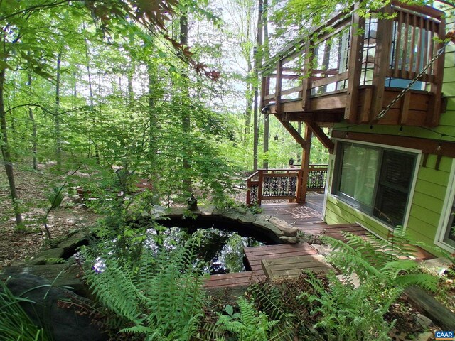 view of yard with a wooden deck