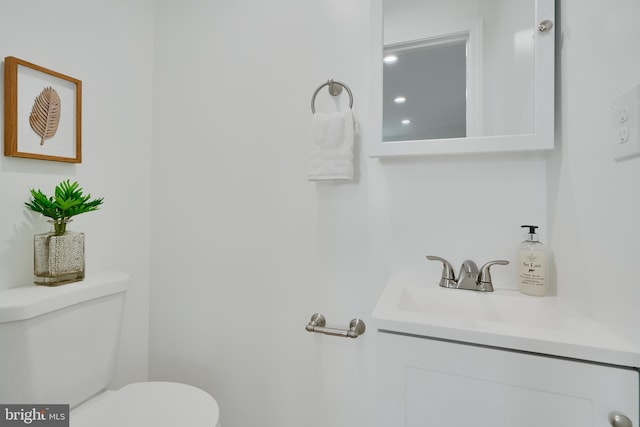 half bath with toilet and vanity
