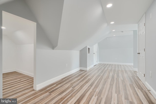 bonus room featuring lofted ceiling, recessed lighting, light wood finished floors, and baseboards