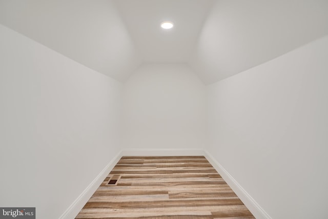 bonus room with light wood-type flooring, baseboards, lofted ceiling, and recessed lighting