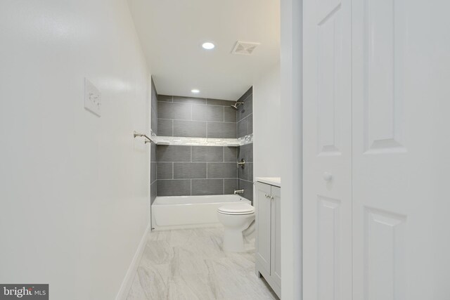 bathroom with marble look tiles, toilet, baseboards, bathtub / shower combination, and recessed lighting