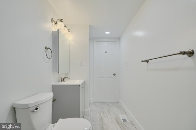 half bath featuring marble look tile flooring, toilet, baseboards, vanity, and recessed lighting