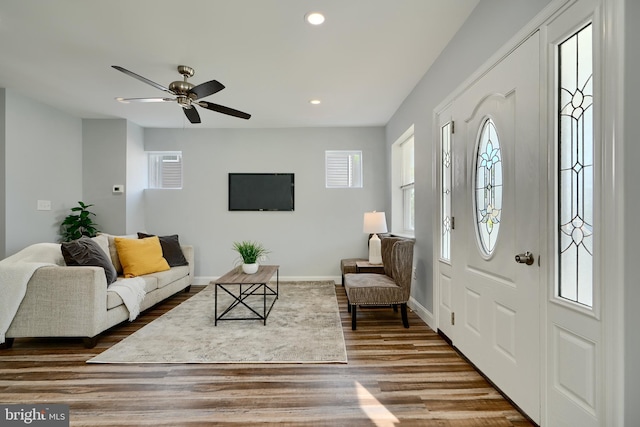 foyer with wood finished floors, recessed lighting, baseboards, and a ceiling fan
