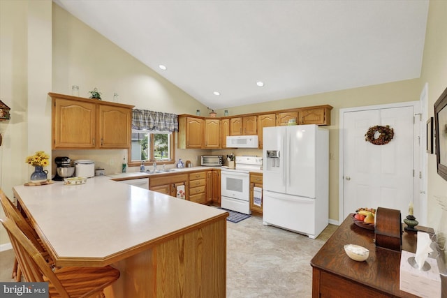 3467 Gleneagles Dr, Chambersburg, PA 17202 - kitchen featuring white appliances, a peninsula, a sink, a breakfast bar area, and light countertops
