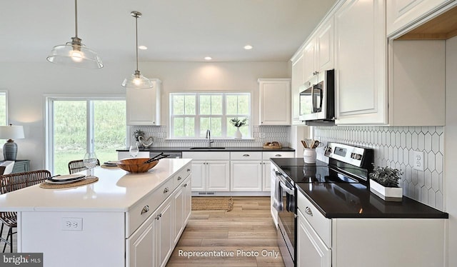416 Allegheny Dr, Mechanicsburg, PA 17055 - kitchen with appliances with stainless steel finishes, a sink, light wood-style floors, white cabinetry, and recessed lighting