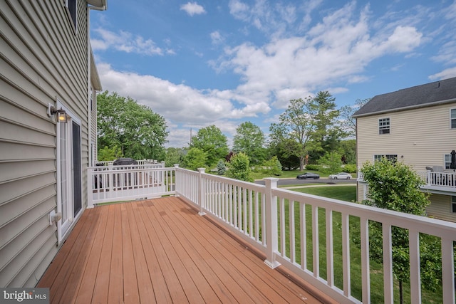deck featuring a yard