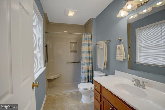 full bathroom featuring curtained shower, vanity, toilet, and healthy amount of natural light